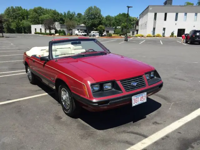 1983 glx 5 speed 5.0 convertible 50,300 original miles. dark red with white top