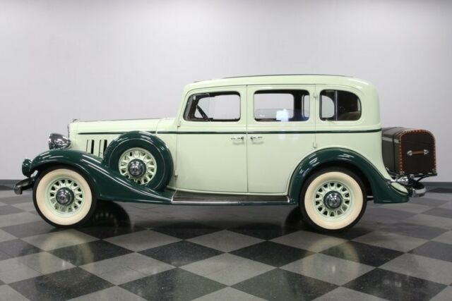 classic vintage chrome white walls saloon green tan broadcloth steamer trunk