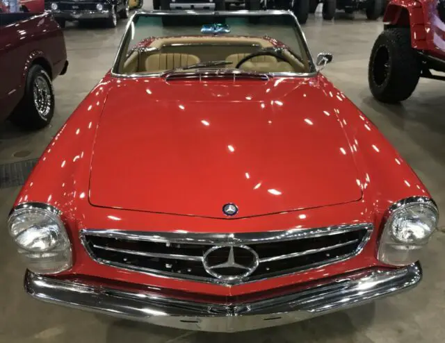 restored 1965 sl 230 convertible with 29,952 miles. 4 speed, air conditioning