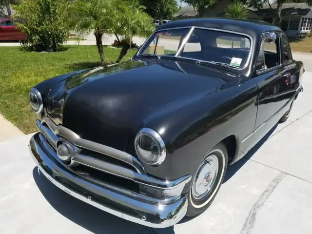 1950 black ford deluxe two-door coupe