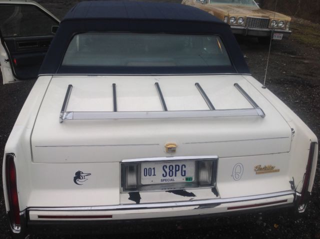 white cadillac deville with 139135 miles