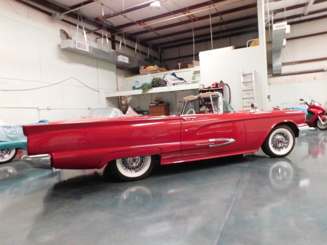 a very rare red t-bird convertible, 352 v8 engine, automatic transmission