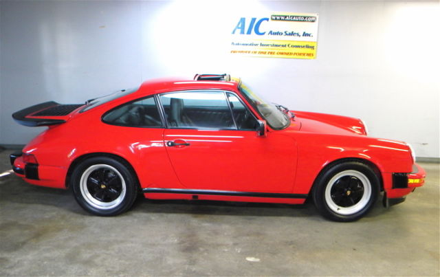 1988 porsche 911 carrera coupe, red/black, 49k.miles, spoilers, 16" fuchs