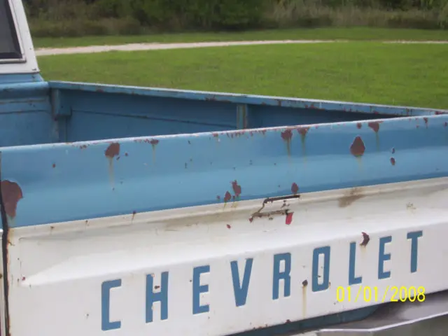 blue and white chevy c10llong bed