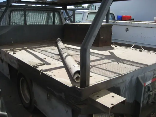 1987 ford f-350 flatbed with rack. dually wheels in back. started with a jump