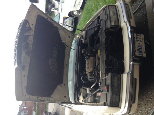 1993 buick riviera, pearl white, opera roof, white leather blue carpeting