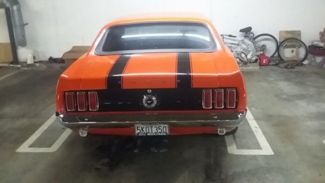 orange and black 1969 ford mustang