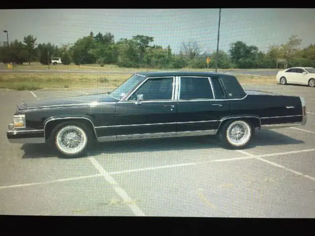 black on black with factory moonroof appliance rims with vogue tires