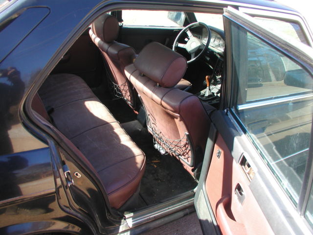 we moved this car from storage -1985 bmw 535i, black outside & chateau interior