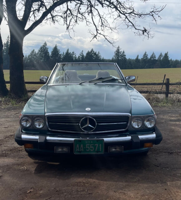 560sl mercedes r107 sl in petrol blue-green metallic. runs and road trips great
