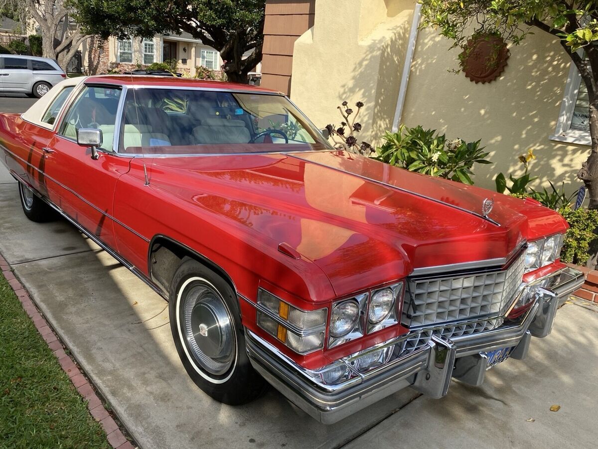 1974 cadillac de ville coupe red