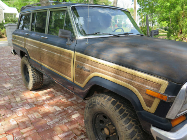 1987 jeep grand wagoneer lifted, trusty, slightly rusty (surface) blue, woody