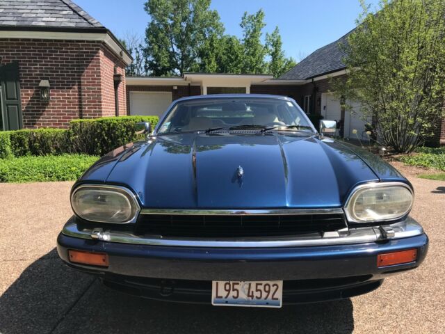 1994 sapphire blue, beige leather interior, convertible in excellent condition