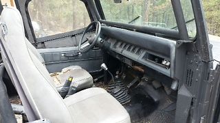 black jeep wrangler with custom cage