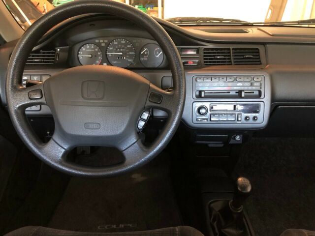 1994 fire engine red ex coupe, 5-speed manual, excellent condition, garaged