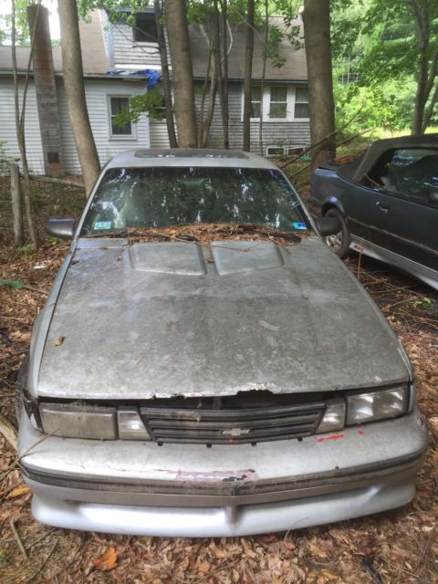 1989 z24 cavalier runs and drives. needs minor repairs. comes with 2 parts cars