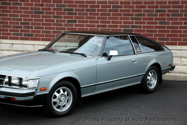 low miles 2 dr coupe unspecified gasoline 2.6 liter metallic silver