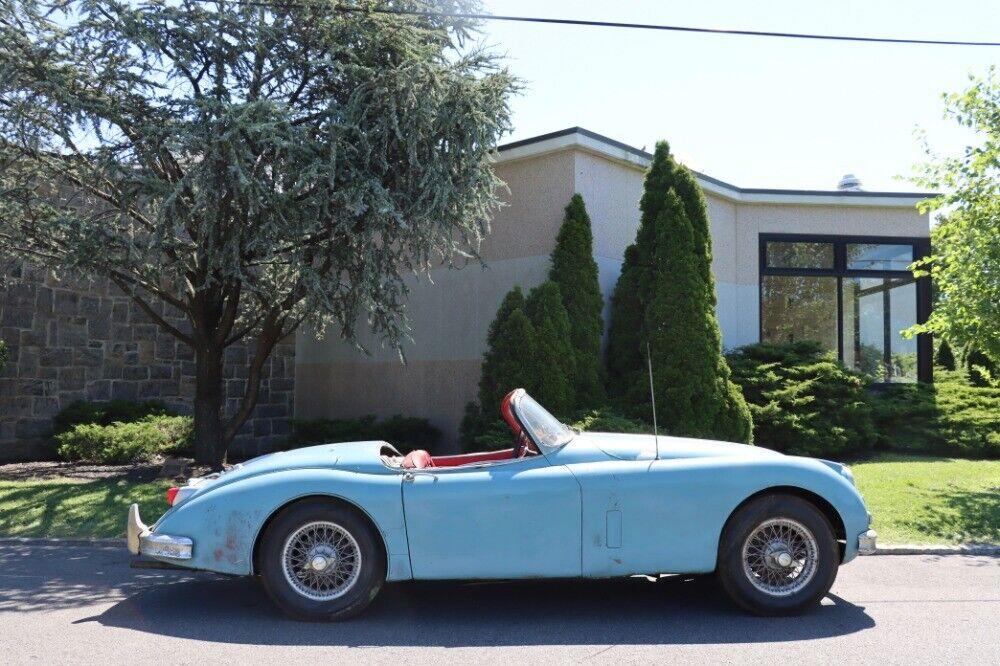 1958 jaguar xk150 roadster blue with red interior