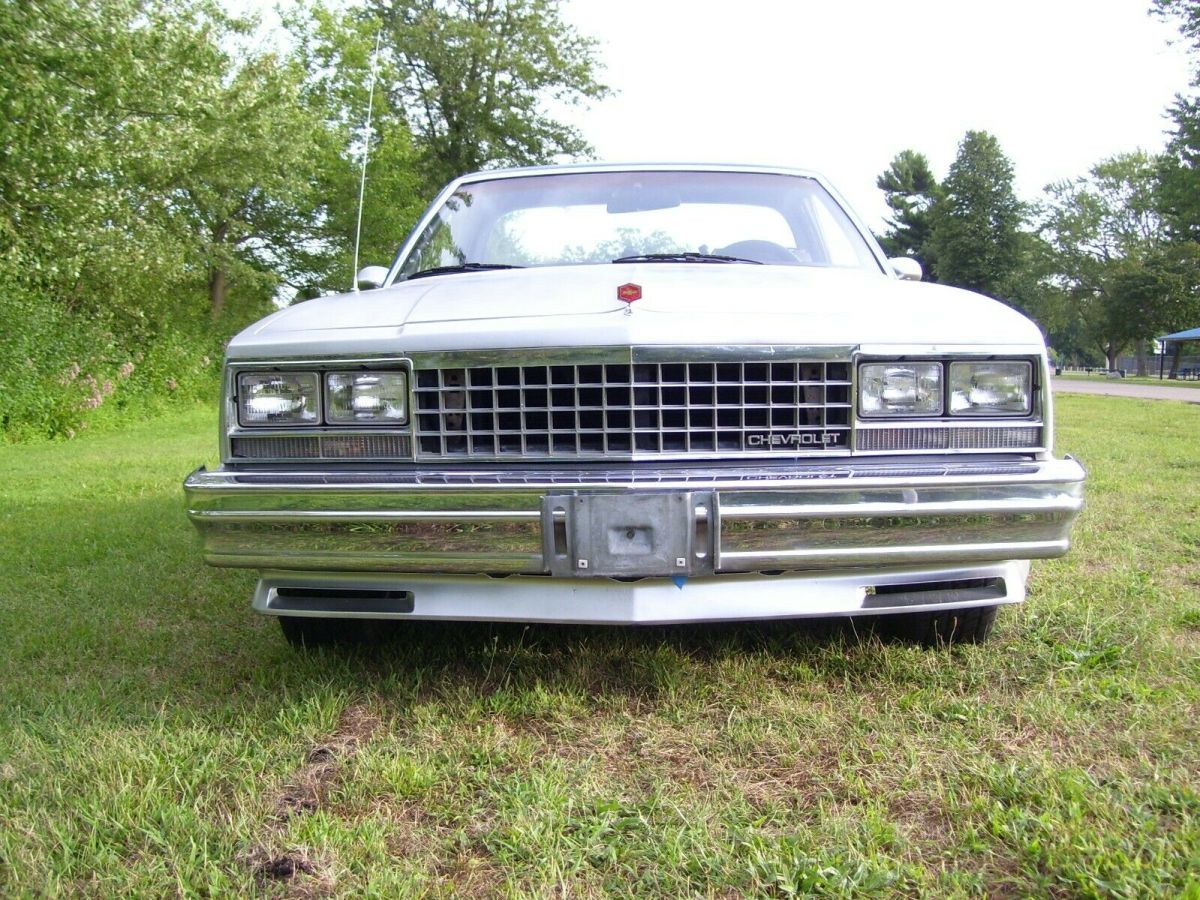 1985 silver and blue el camino ss