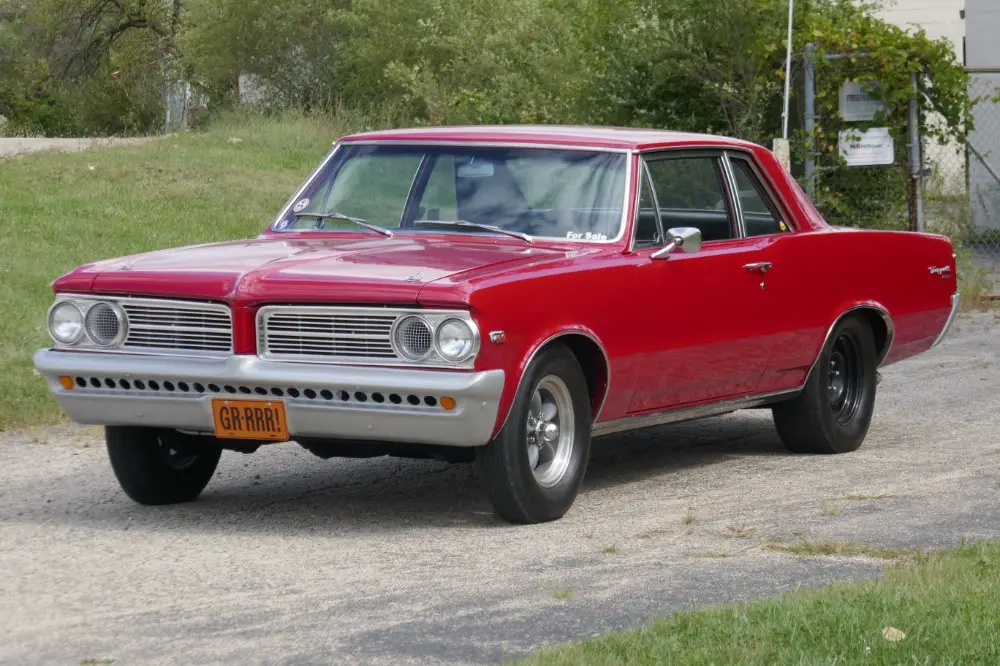 pontiac tempest red with 78,394 miles, for sale!