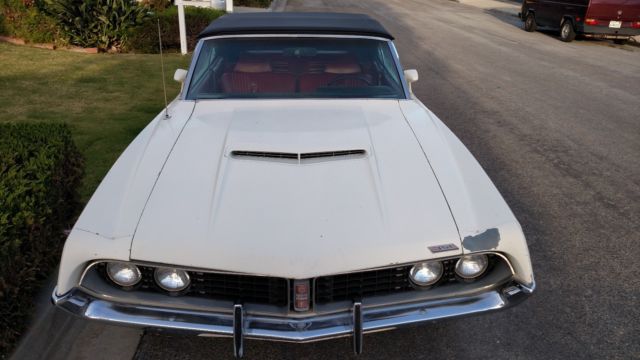 white torino gt with black convertible top with red interior