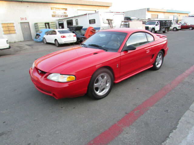 mustang cobra 1994 - red w/tan leather interior - 302.5spd - original cond