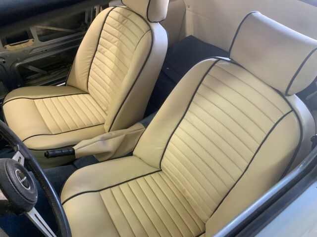 restored triumph tr6. bare metal respray. leather interior. new soft / hard top