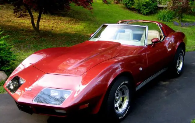 t-top coupe, new dark red met paint,crate 350,4 speed,polished alum rims w/t/a's