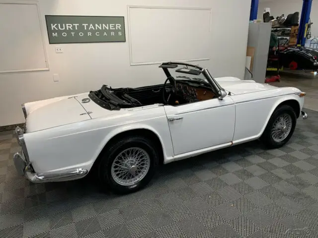 1967 triumph tr4a. solid axle 4-speed, 60-spoke wire wheels. good driver