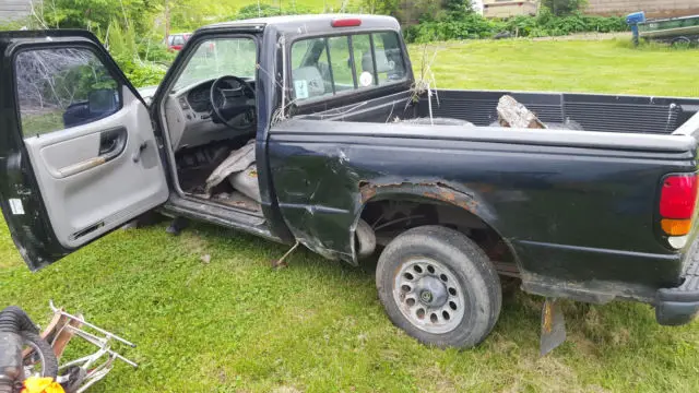 mazda b2300 for parts, good trans and many other parts, decent tires, no reserve