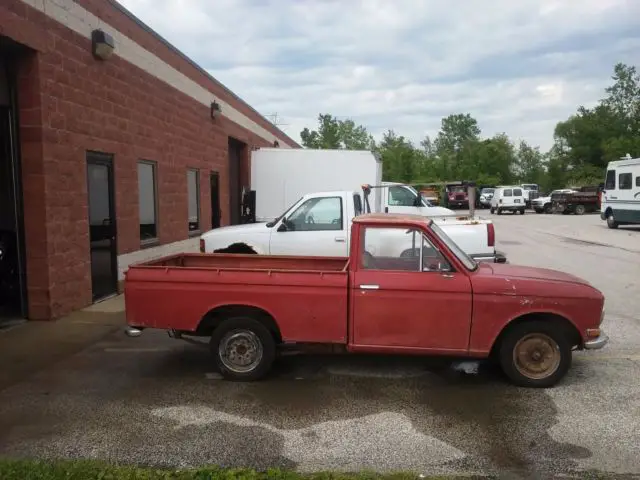 1966 red patina 4-speed datsun pickup truck 1300