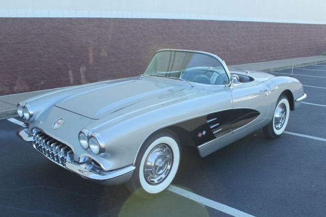 1959 gorgeous silver corvette convertib with black coves. frame off restoration