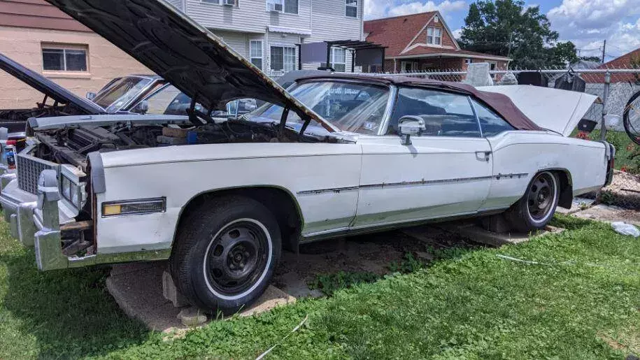 1976 white cadillac eldorado convertible with red interior