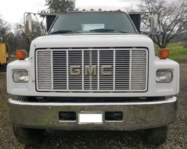 1984 gmc top kick cat 3116 powered 6 sp. flat bed w/ stakes. good tires