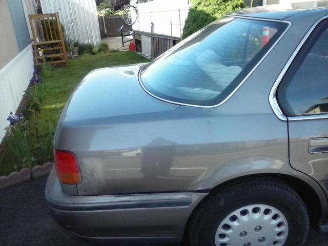 excellent condition. 16,472 miles. gray color. 4dr. interior in great shape