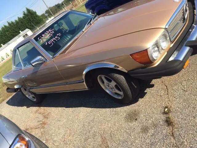 380sl convertible with the hard top in an elegant gold color with brown, inter