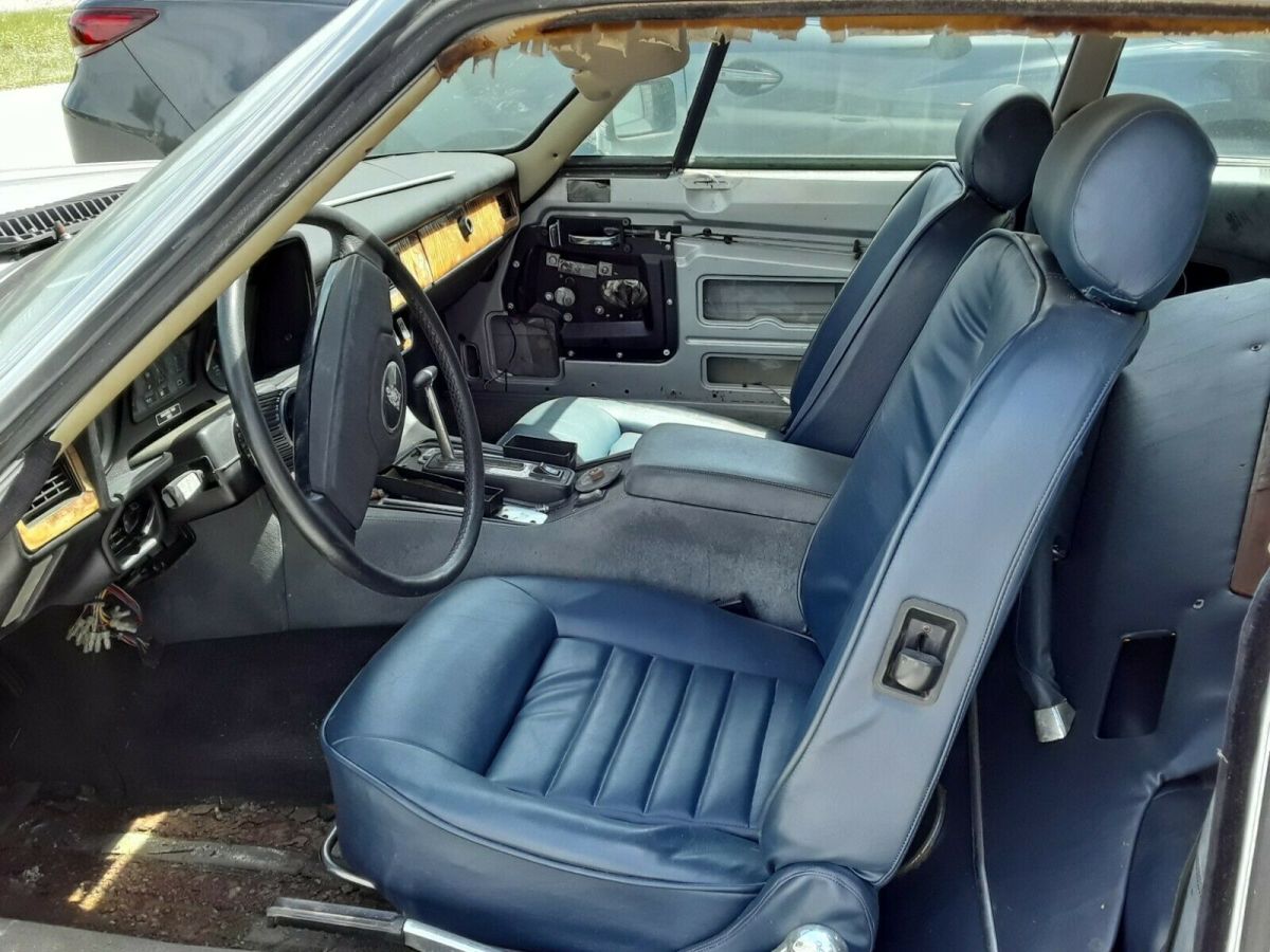 two 1986 xj12 jaguars 1 silver and 1 maroon
