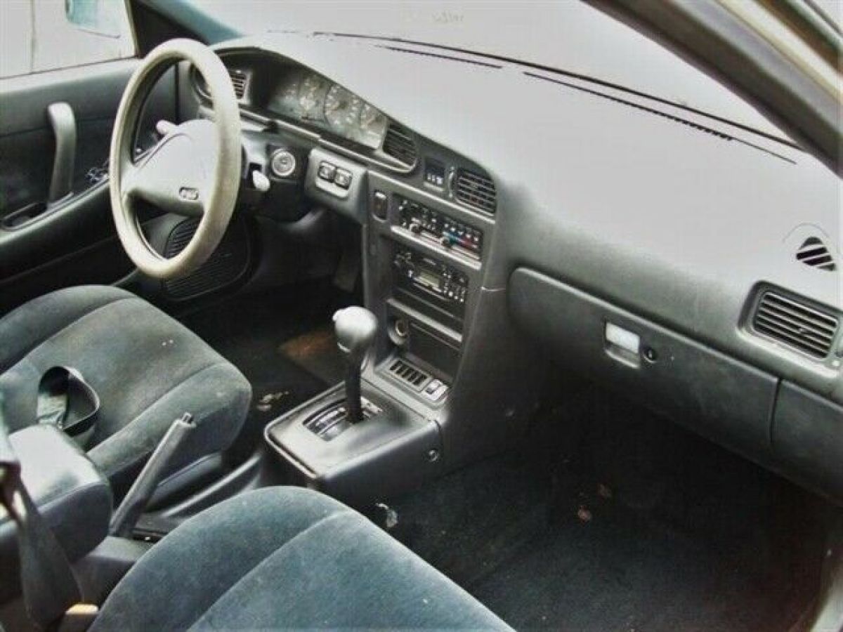 1990 nissan maxima gxe 236386 miles pebble beige metallic 4 door 3.0l 6 cyl. gas