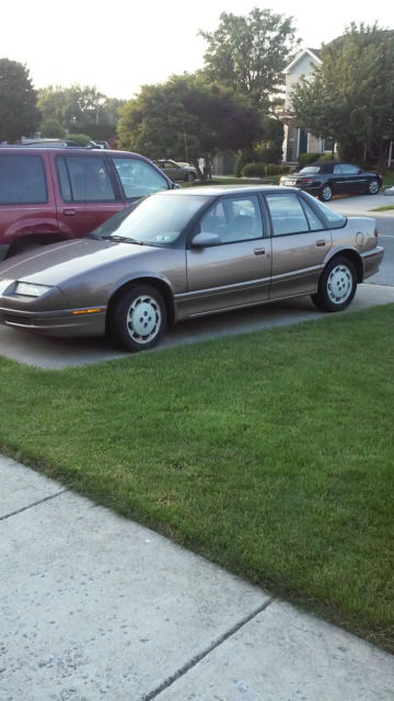4 door gold, runs good!!