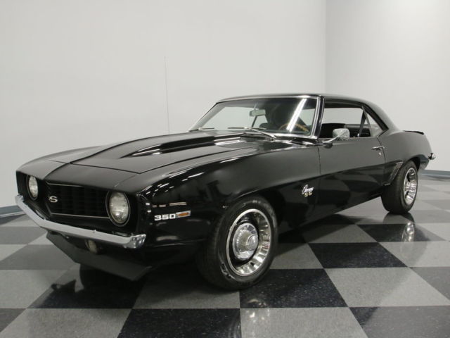 nicely built 350ci small block, black on black, slick paint, buckets w/ console