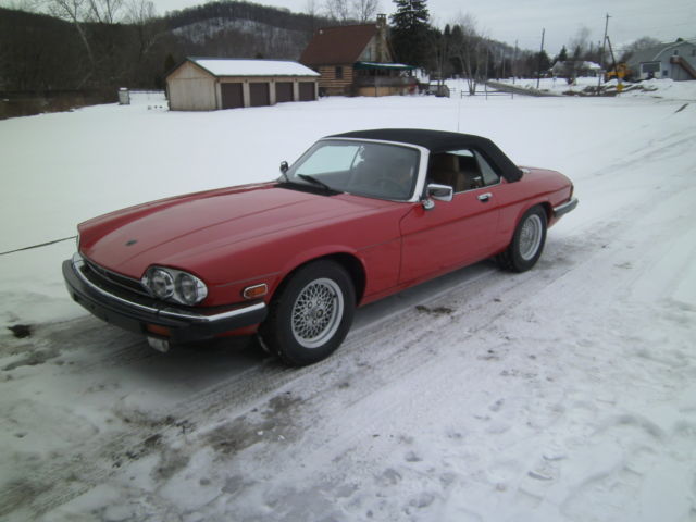 classic collectible jaguar red convertible garage kept since new. nice for the $