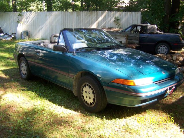 two mercury capri convertibles 1991 and a 1993
