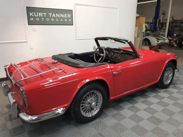 1968 triumph tr4a. red/black. nicely restored, sharp looking car. 73,565 miles
