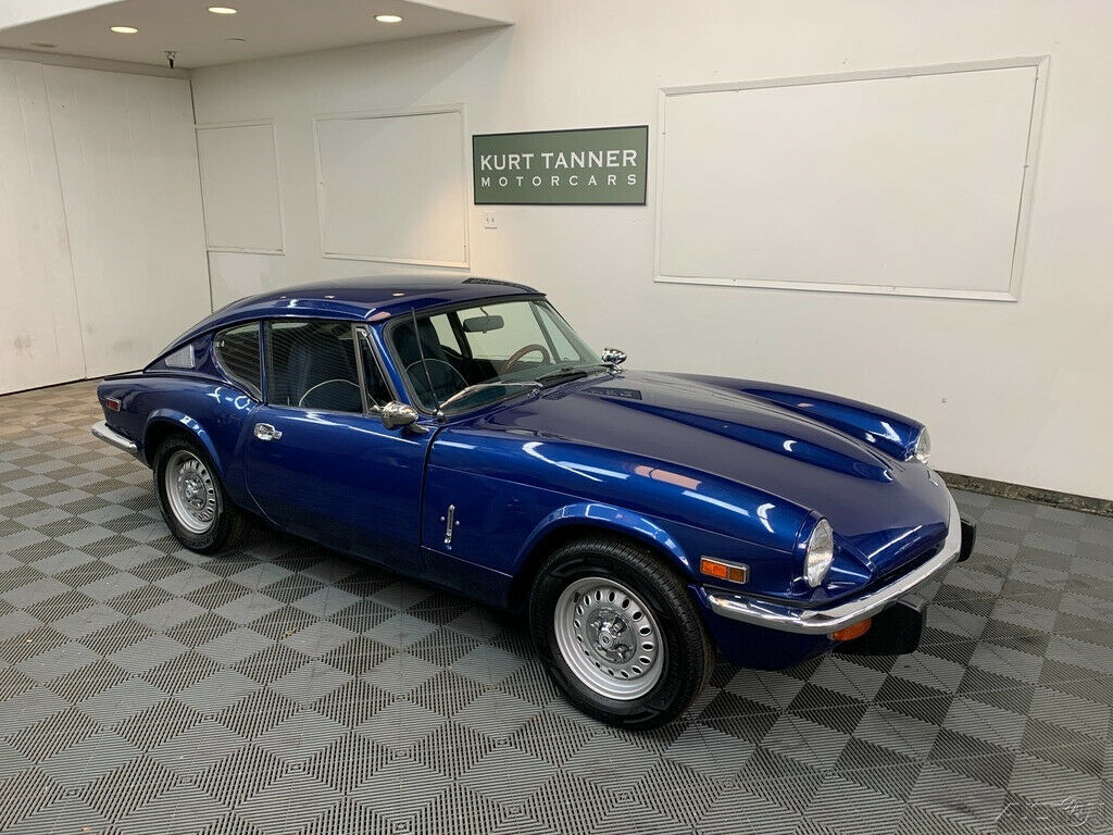 1972 triumph gt-6 mk3. 4-speed, standard wheels. alloy/wood steering wheel