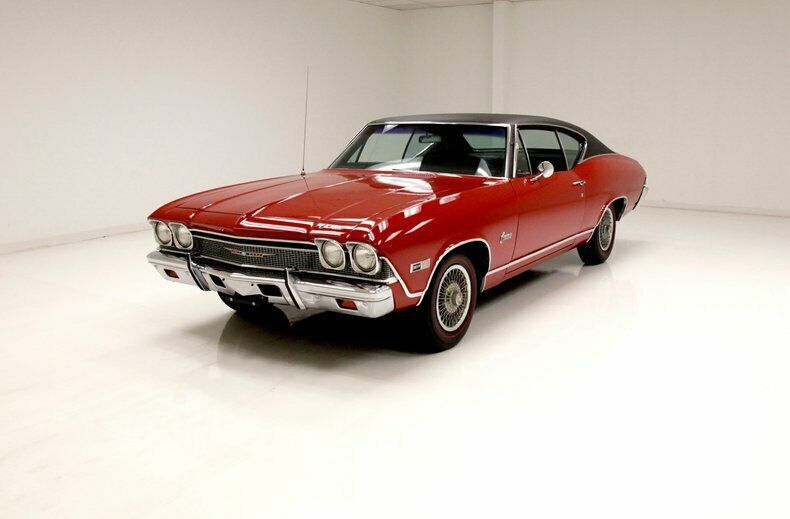 rarely seen example/deep red paint/black vinyl top/307ci v8
