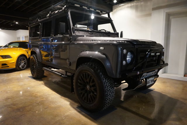 land rover defender 110 metallic grey over black diamond stitched leather