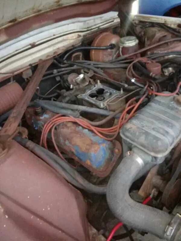 two cars with one that could be used as parts for the other