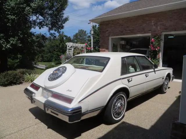 cadillac seville 1983 white with red interior. all original. 76,800 miles