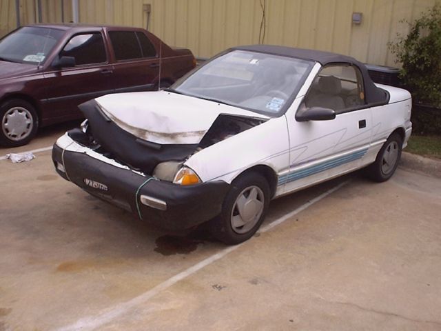 1992 (white) geo metro convertible (some front end damage)