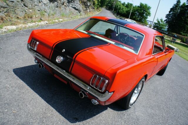 stuffed ! what a stang ! . loaded with upgrades ! 4 speed / ac / gorgeous !!